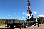 Бортовой автомобиль FAW с КМУ UMM 76 ТБ с буровой установкой